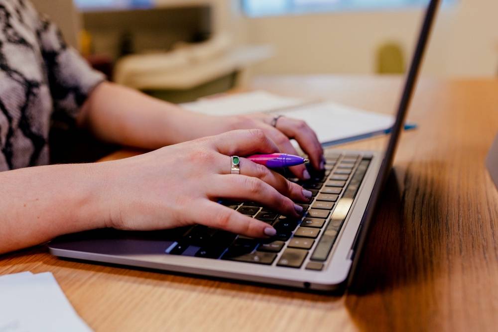 Rockfine Business Growth Consultancy working on laptop